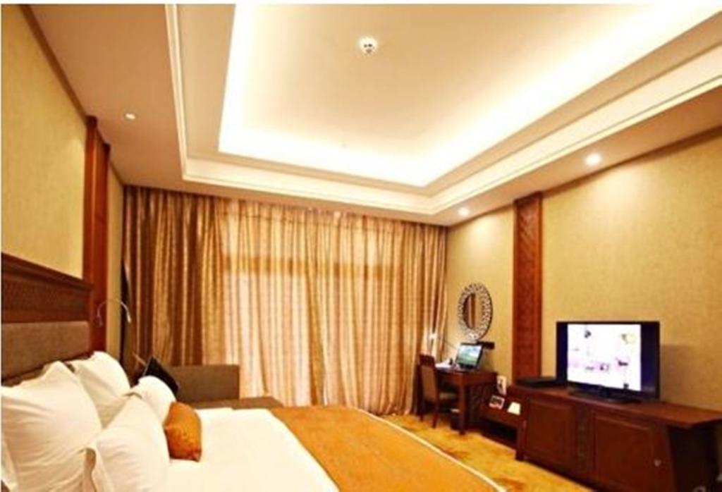 Hotel Ramada Plaza Xishuangbanna Exterior foto